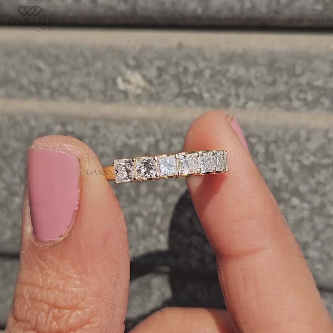 seven stone princess cut lab grown diamond wedding band in 14K yellow gold. A classic half eternity ring for weddings, anniversaries and stacking.