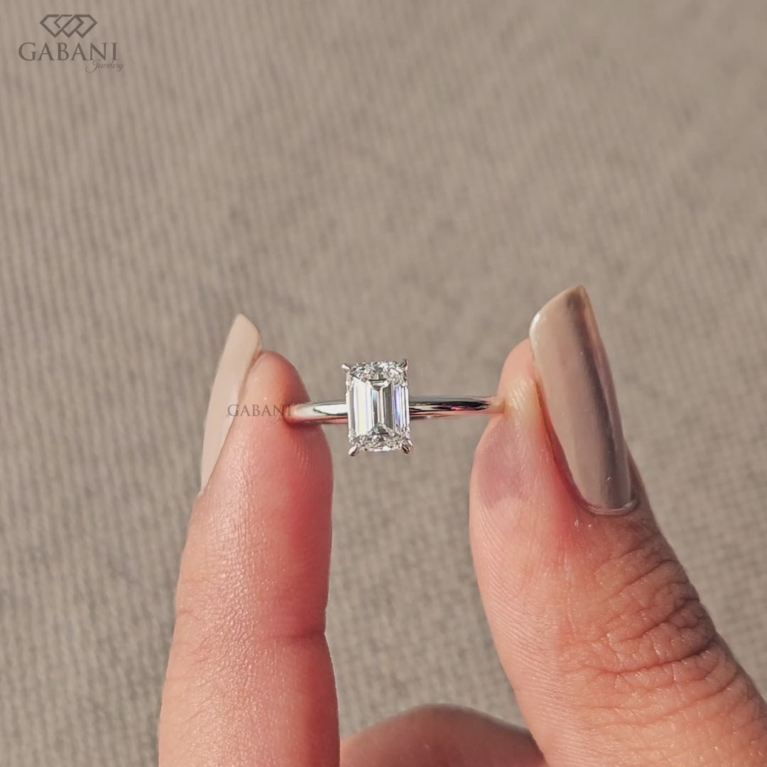 emerald cut lab grown diamond ring with flat basket prong setting in solid white gold