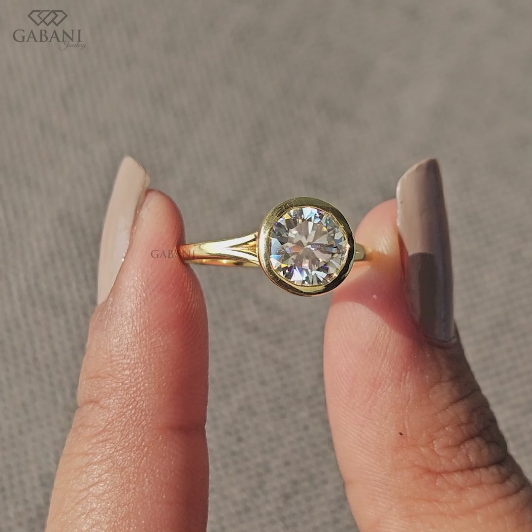 Round cut lab grown diamond solitaire ring in yellow gold bezel setting