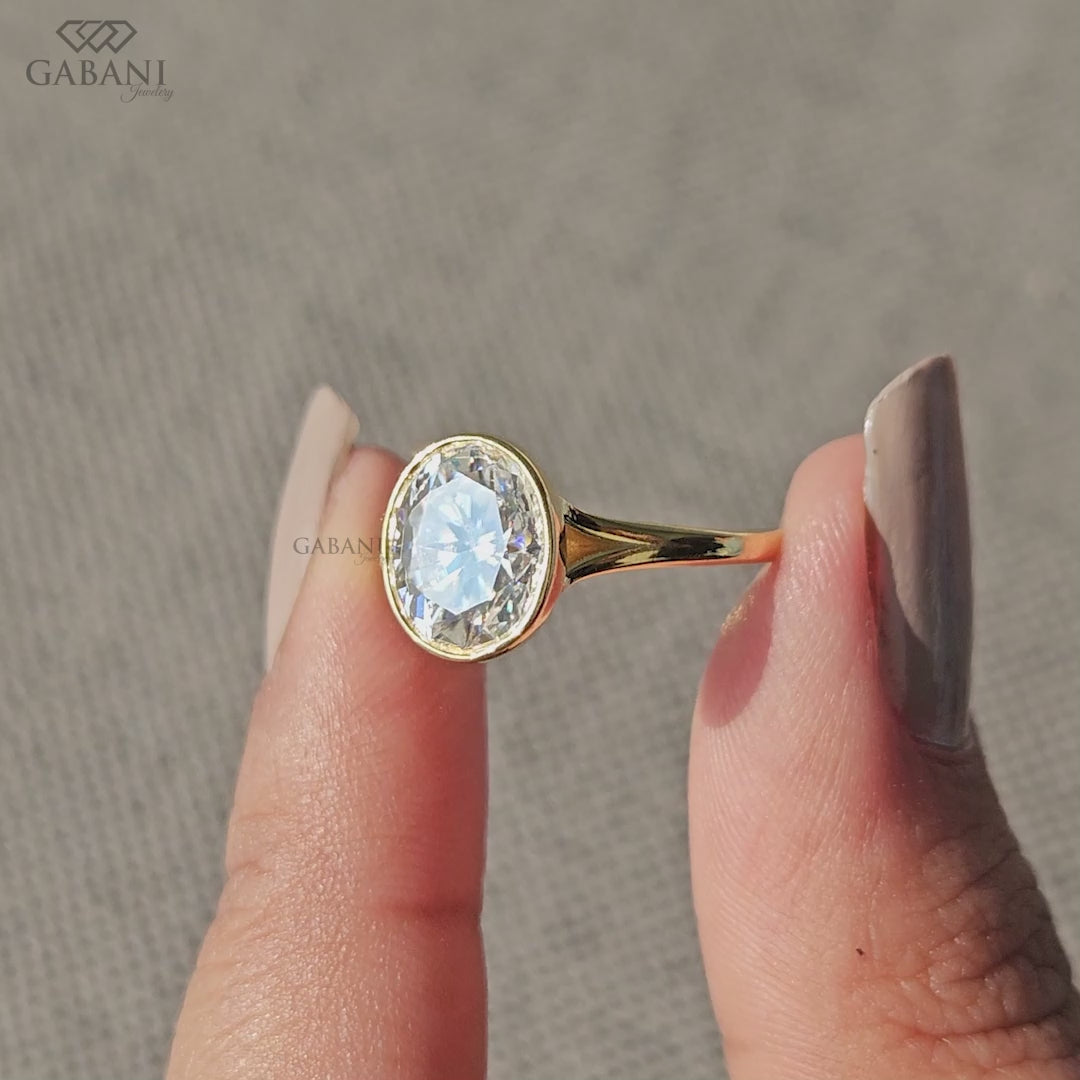 Yellow gold ring with oval lab grown diamond and smooth sleek band