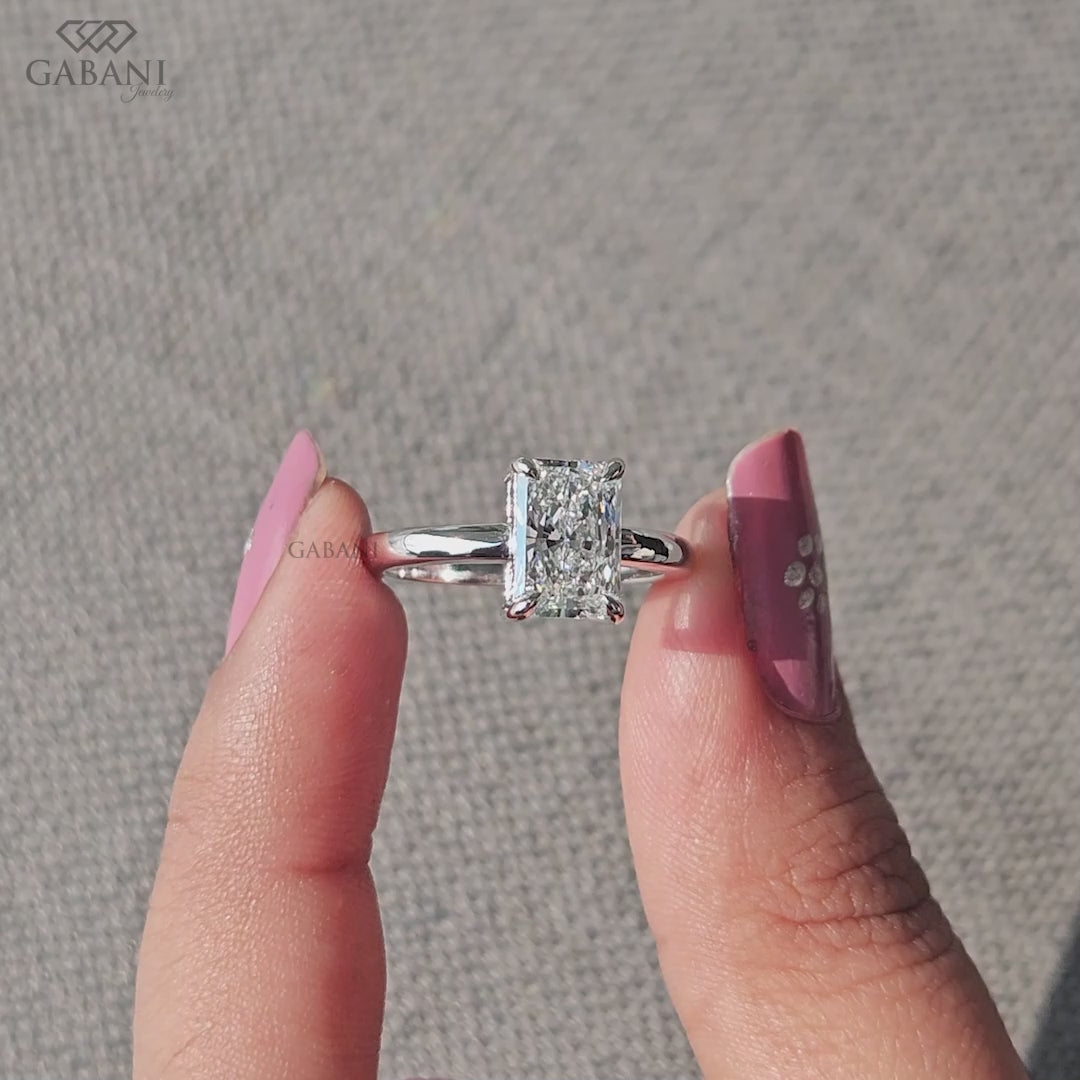 elongated radiant cut lab grown diamond ring set in solid 14k white gold solitaire design