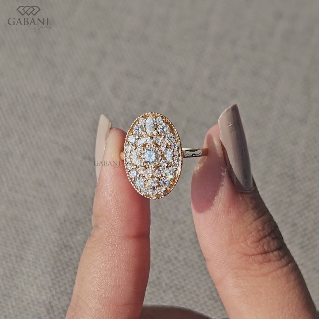 Oval mosaic diamond ring with marquise and round stones
