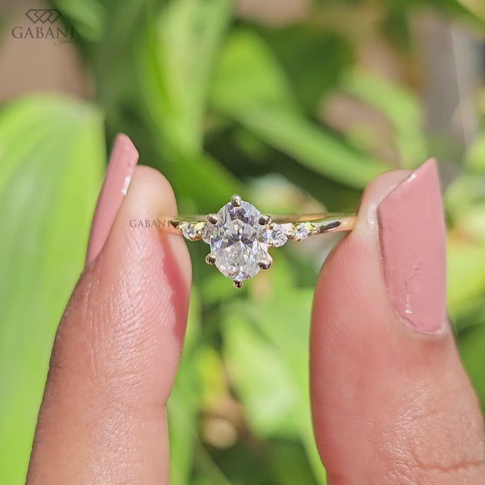 Oval lab grown diamond ring with delicate round diamond side accents