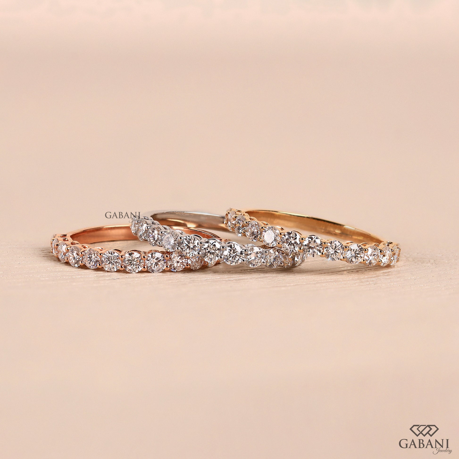 Round lab grown diamond half eternity wedding band in yellow gold with shared prong setting and slim minimal design