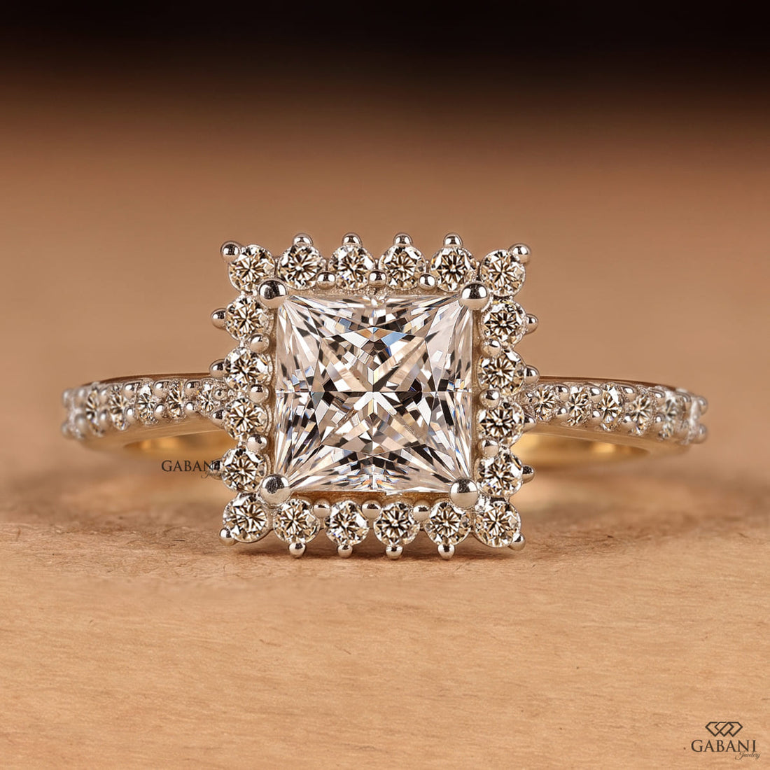 Princess cut lab grown diamond engagement ring in yellow gold featuring a round diamond halo and pave diamond band, designed as a bridal, proposal, anniversary, or engagement ring.