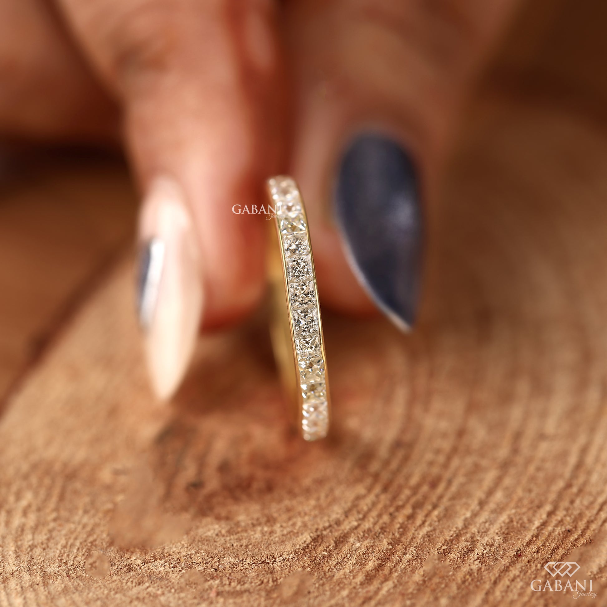 princess cut lab grown diamond channel wedding band with clean modern yellow gold finish