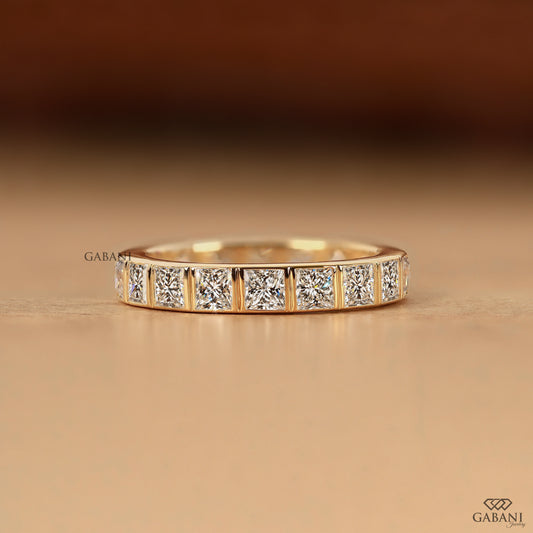 princess cut lab grown diamond bezel wedding band with thick gold band by Gabani Jewelry