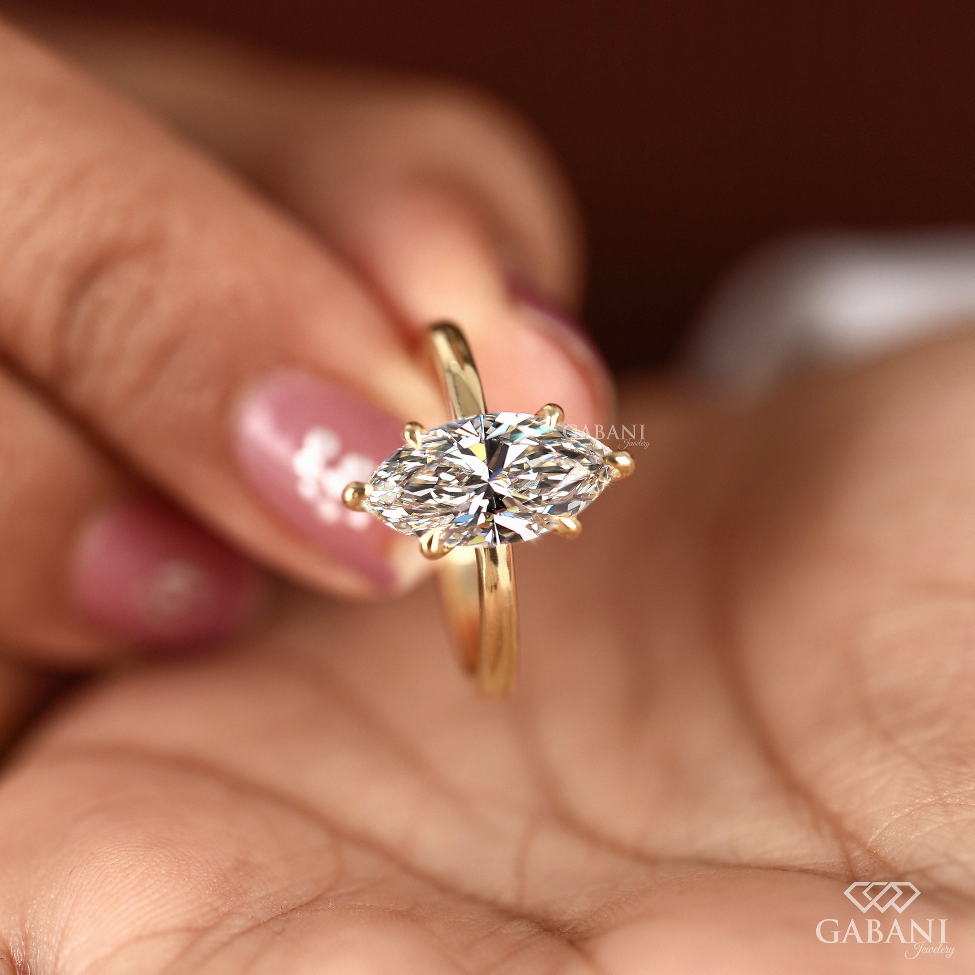 Yellow gold marquise diamond solitaire with six prong setting

