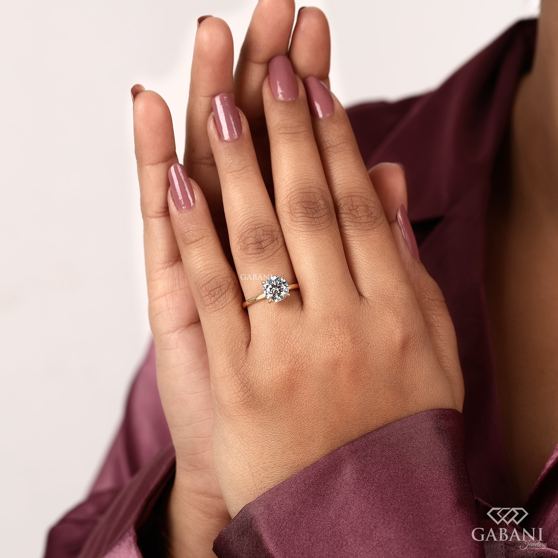 yellow gold solitaire ring featuring round cut lab grown diamond