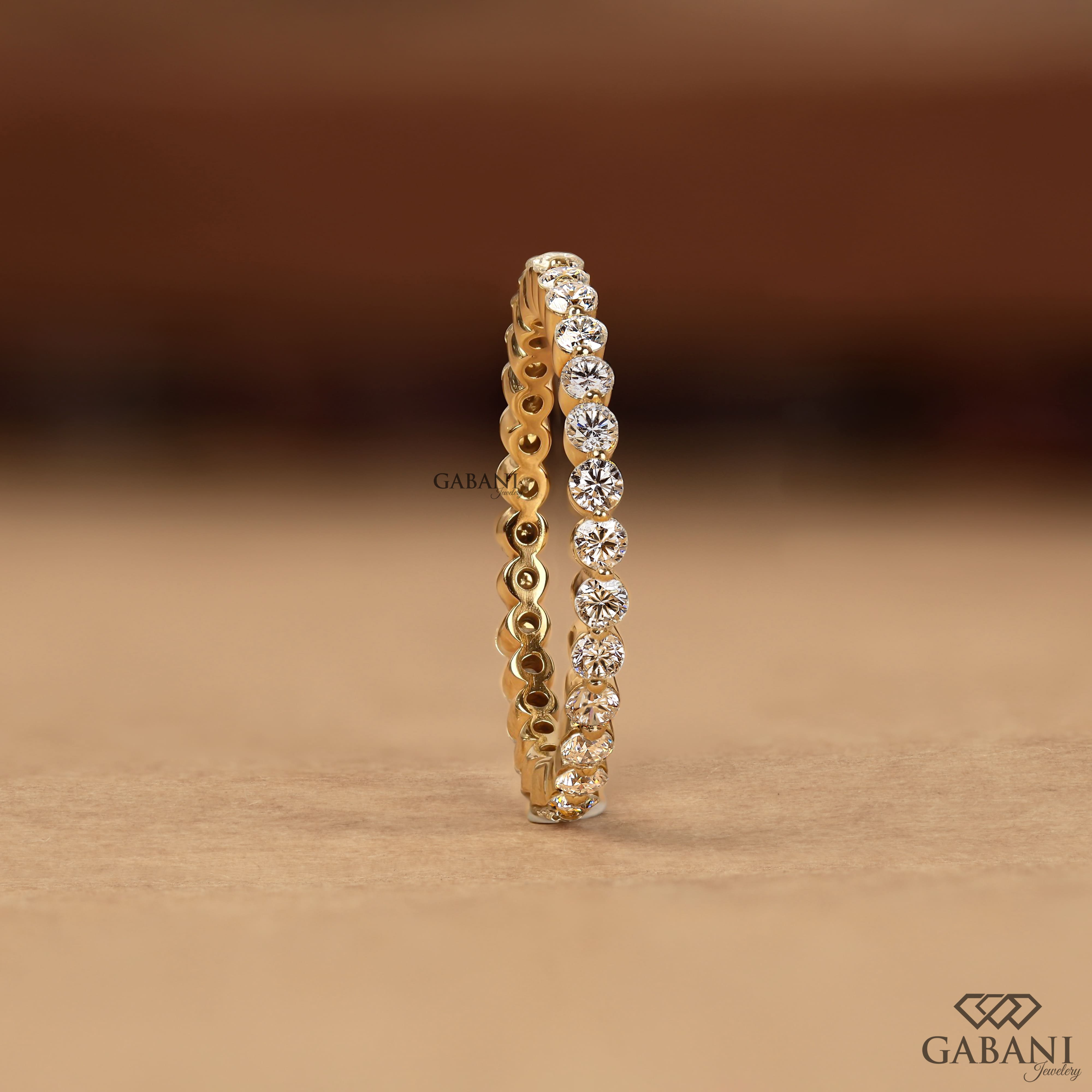 Round cut lab grown diamond full eternity wedding band in yellow gold with shared prong setting and continuous diamond design.
