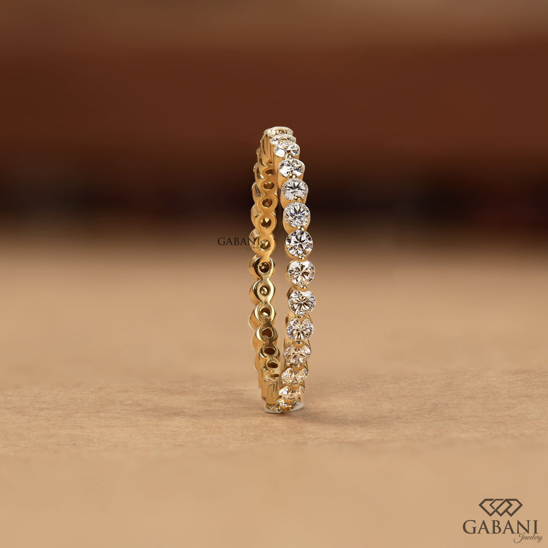 Round cut lab grown diamond full eternity wedding band in yellow gold with shared prong setting and continuous diamond design.