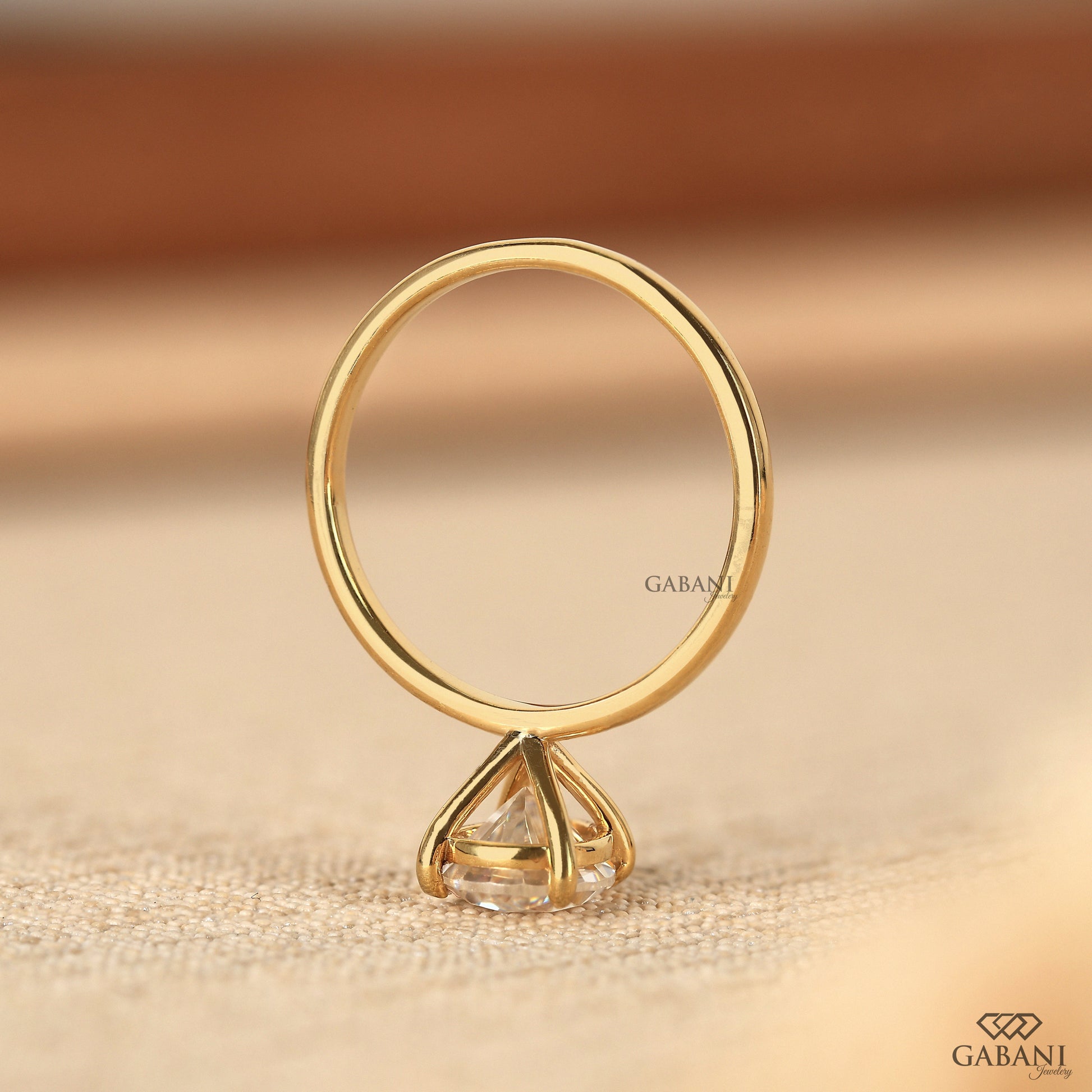 elegant pear cut lab grown diamond solitaire ring in yellow gold
