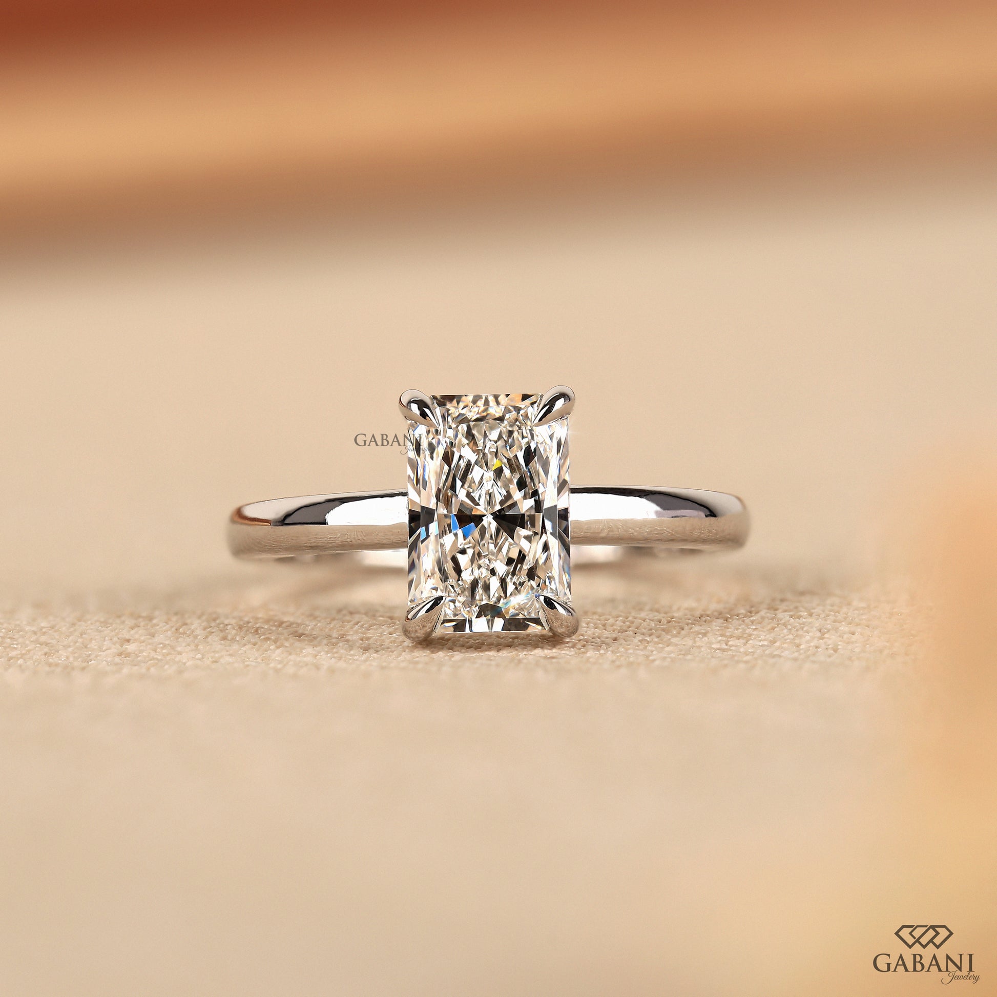 radiant cut lab grown diamond solitaire ring in 14k white gold with claw prong setting and smooth pipe shank