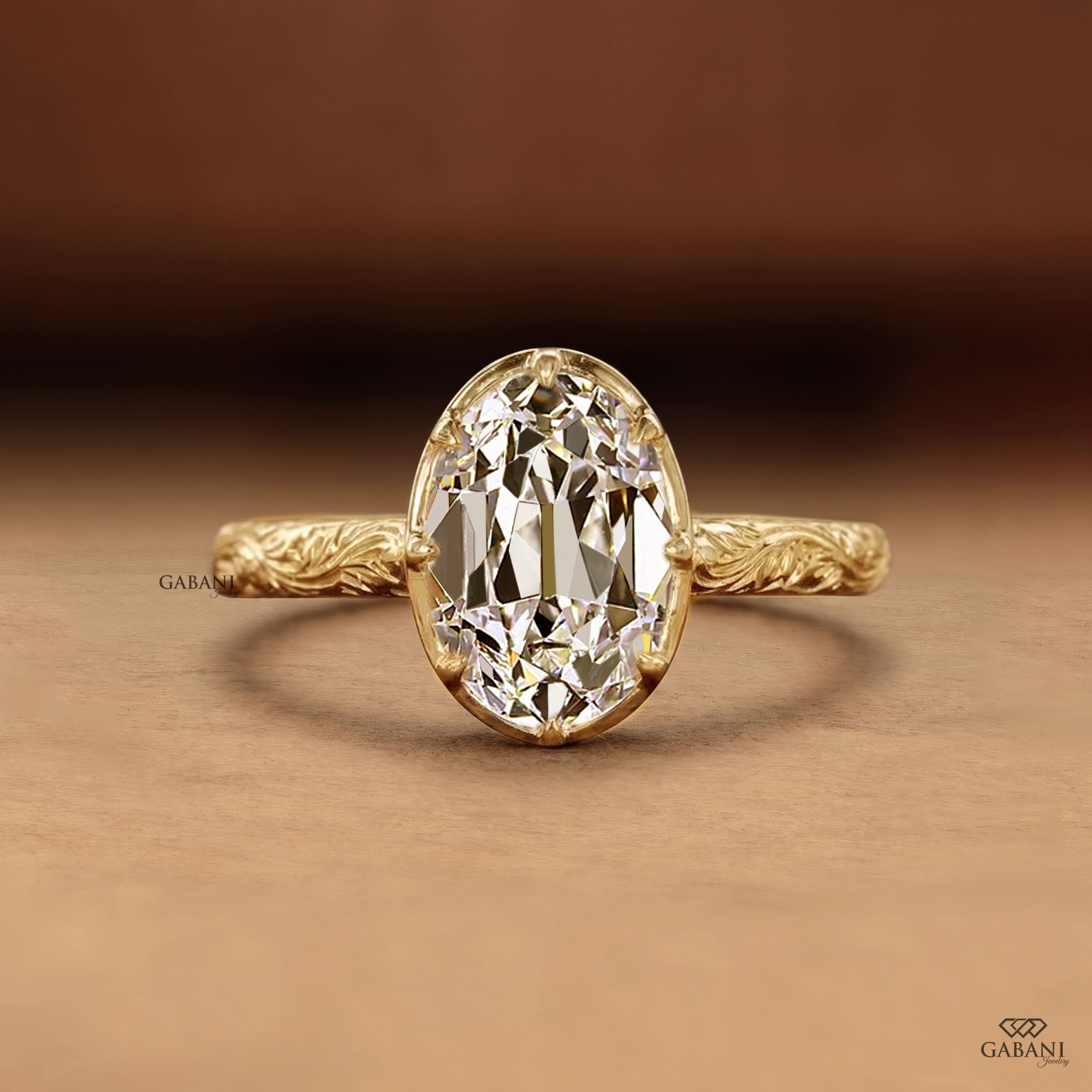 Oval old mine cut lab grown diamond engagement ring in 18K yellow gold with a vintage engraved band and antique-inspired detailing.
