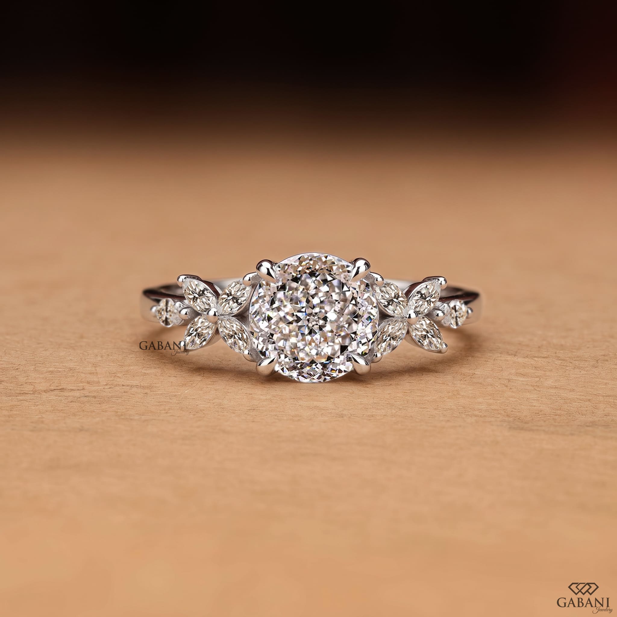 Round Portuguese cut lab grown diamond engagement ring with marquise leaf side stones in polished white gold.