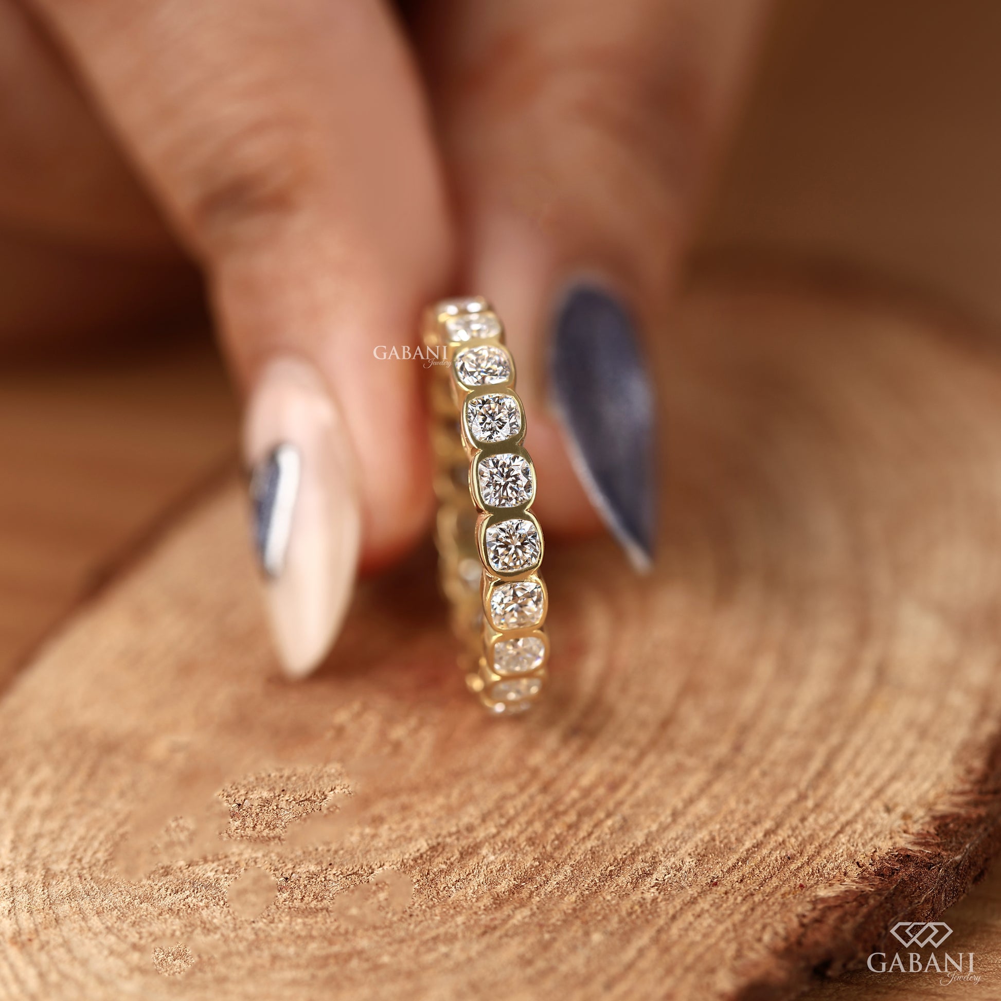 Lab grown diamond band showcasing cushion cut stones in a clean bezel set eternity style