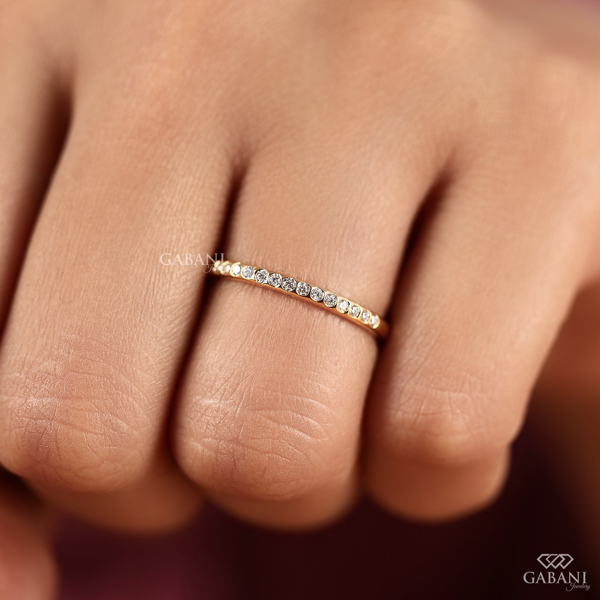 minimal gold band with lab grown diamonds in half eternity flush setting