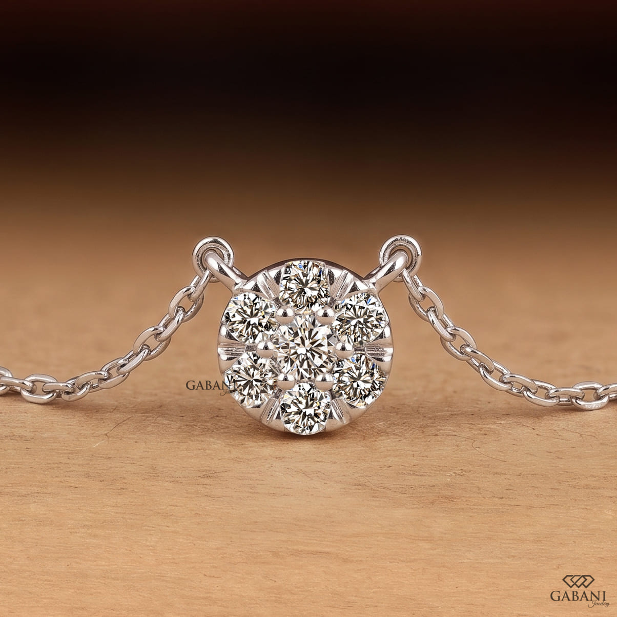 Seven stone round cut lab grown diamond floral cluster necklace in 18K white gold with a delicate cable chain and prong setting.