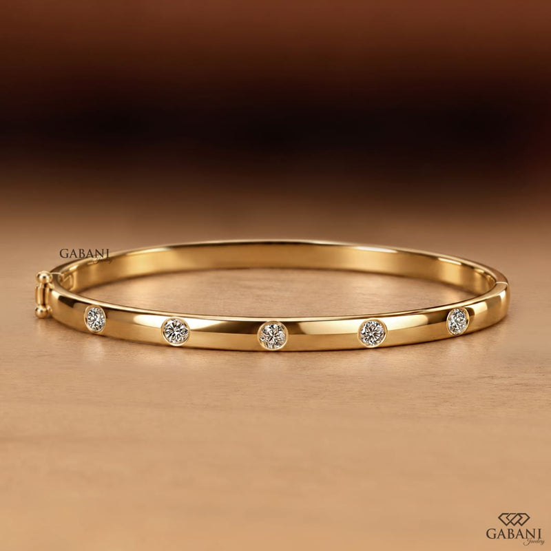 Round Cut Diamond Bezel Set Bangle Bracelet in Yellow Gold