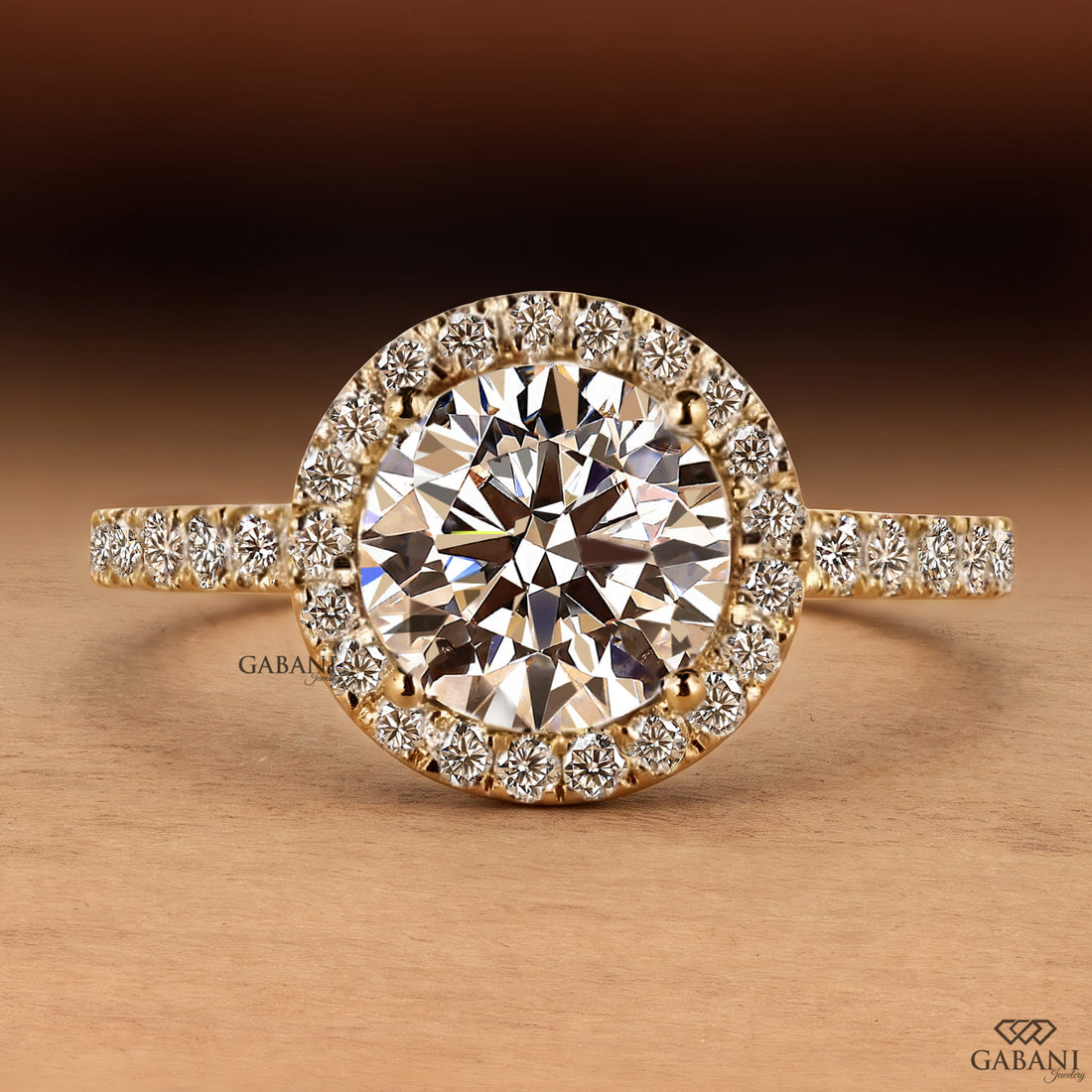round brilliant cut lab grown diamond engagement ring with a sparkling diamond halo and yellow gold pavé band.