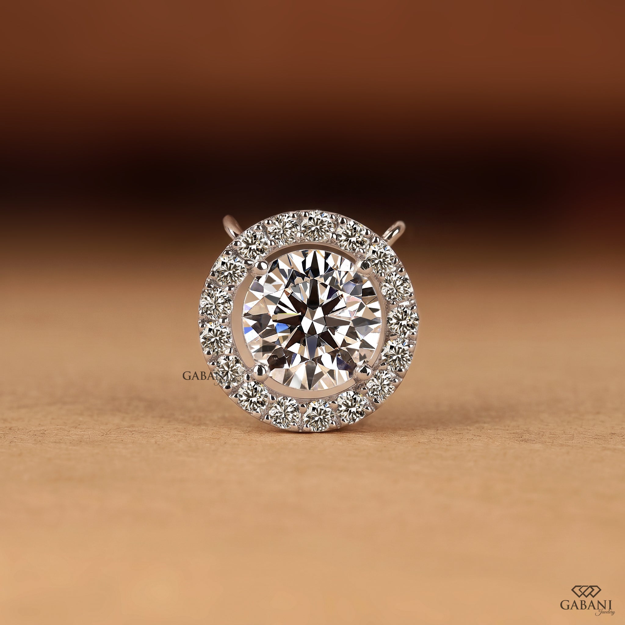 Round cut lab grown diamond floating halo pendant in white gold with a four prong center setting and circular pavé diamond halo.