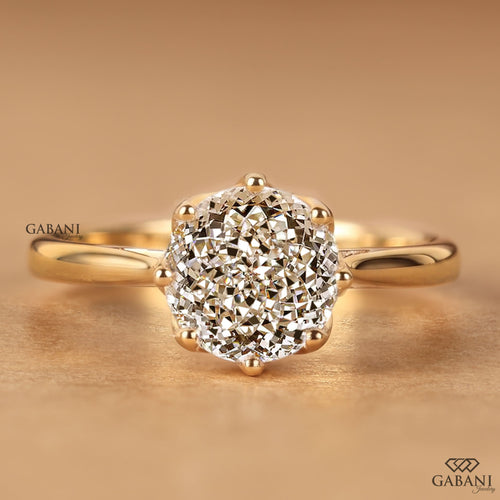 Round Portuguese cut lab grown diamond solitaire engagement ring in yellow gold with a six-prong floral basket and polished plain band.