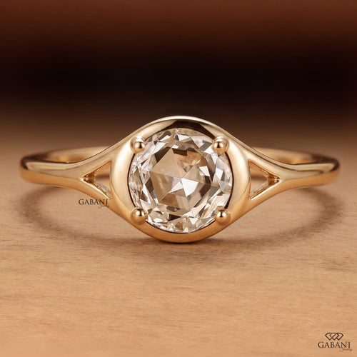 Round rose cut lab grown diamond engagement ring with sculpted bezel setting and polished 14K yellow gold band