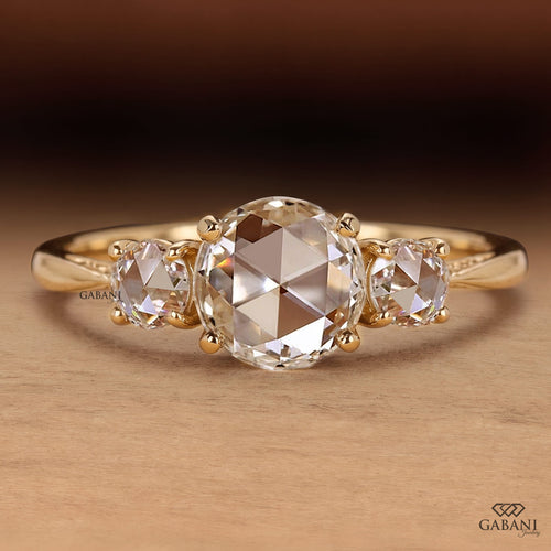 Round rose cut lab grown diamond three stone engagement ring with matching side diamonds, classic prong setting and vintage inspired design.