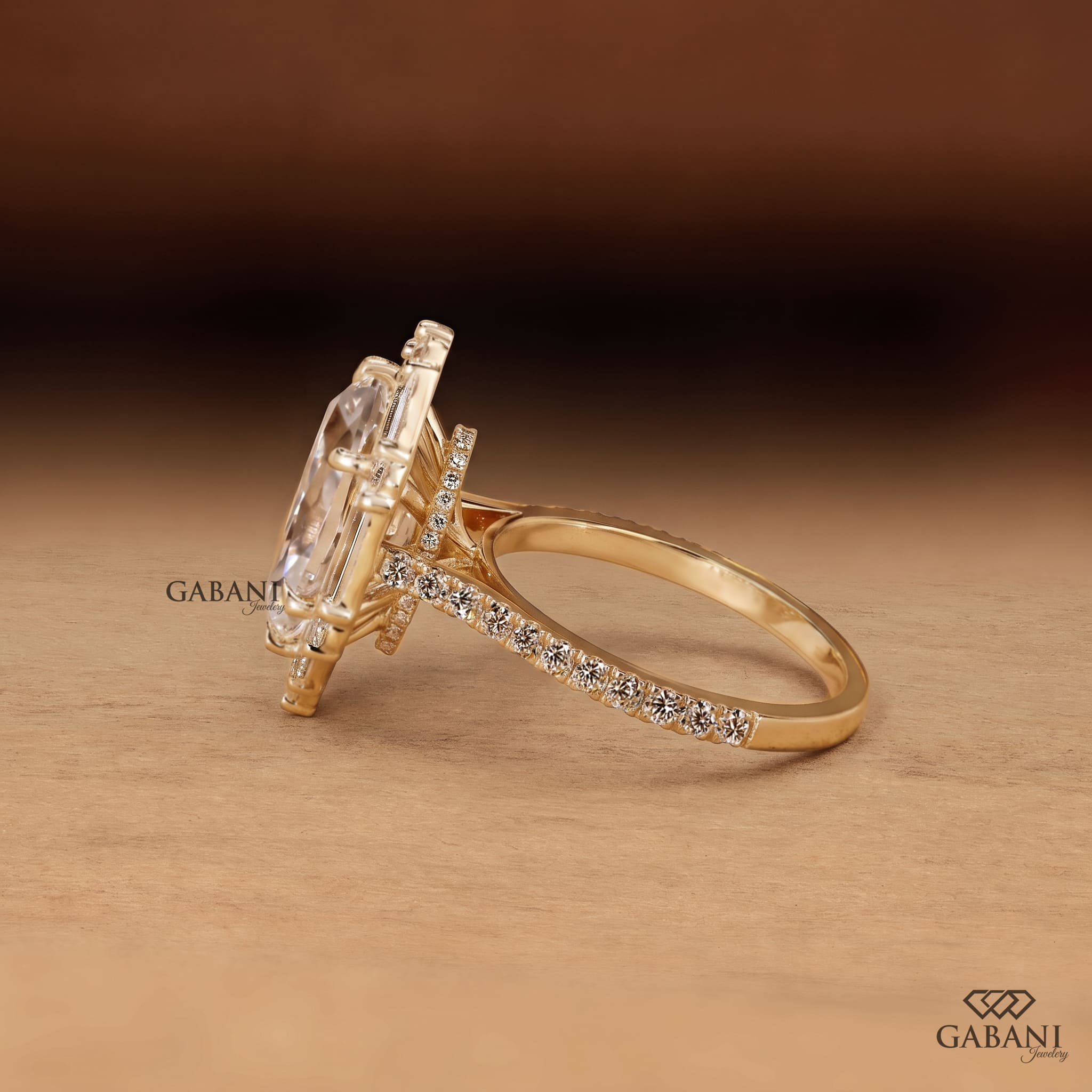 Marquise cut lab grown diamond engagement ring with baguette and round diamond accents, pavé band and yellow gold setting.