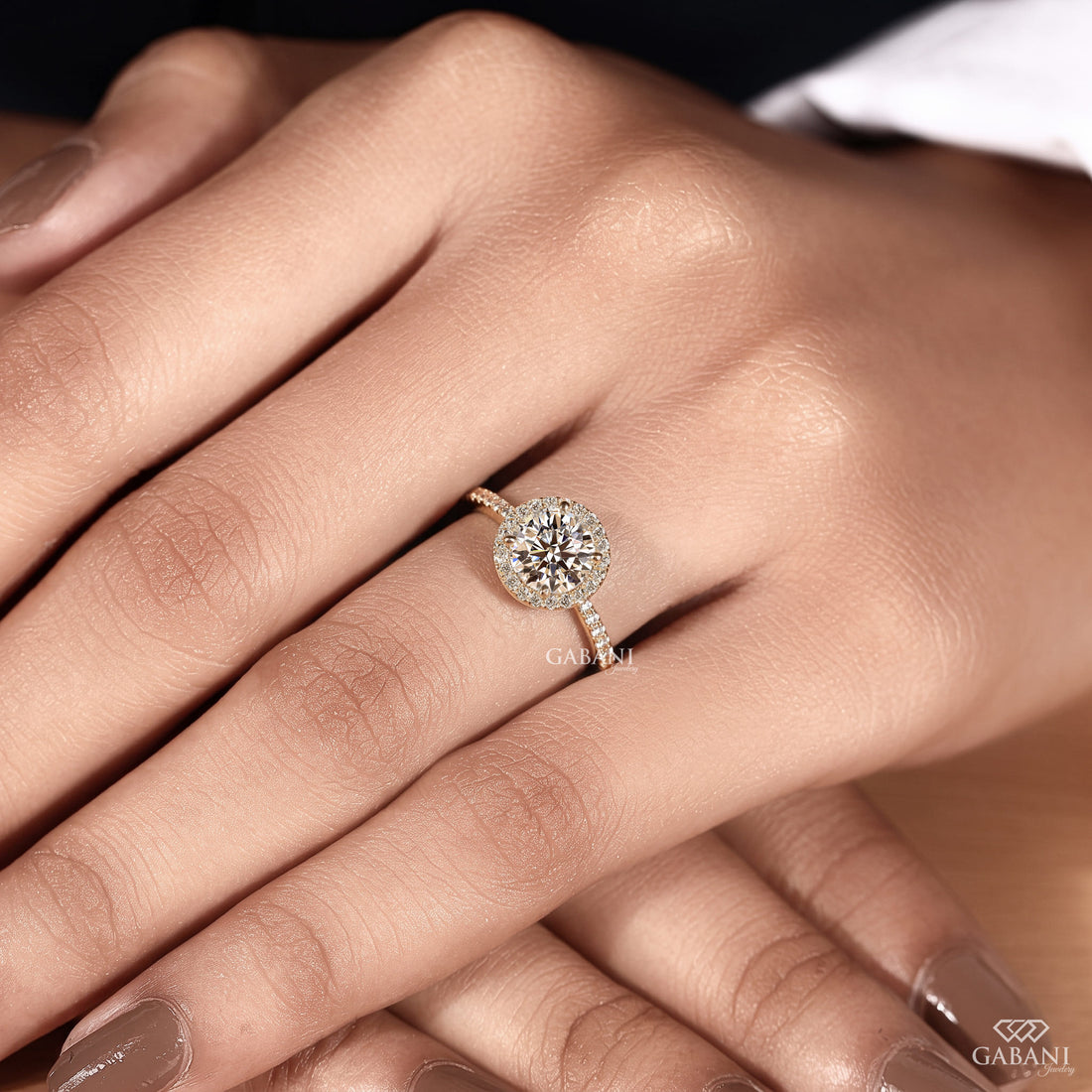 round brilliant cut lab grown diamond engagement ring with a sparkling diamond halo and yellow gold pavé band.