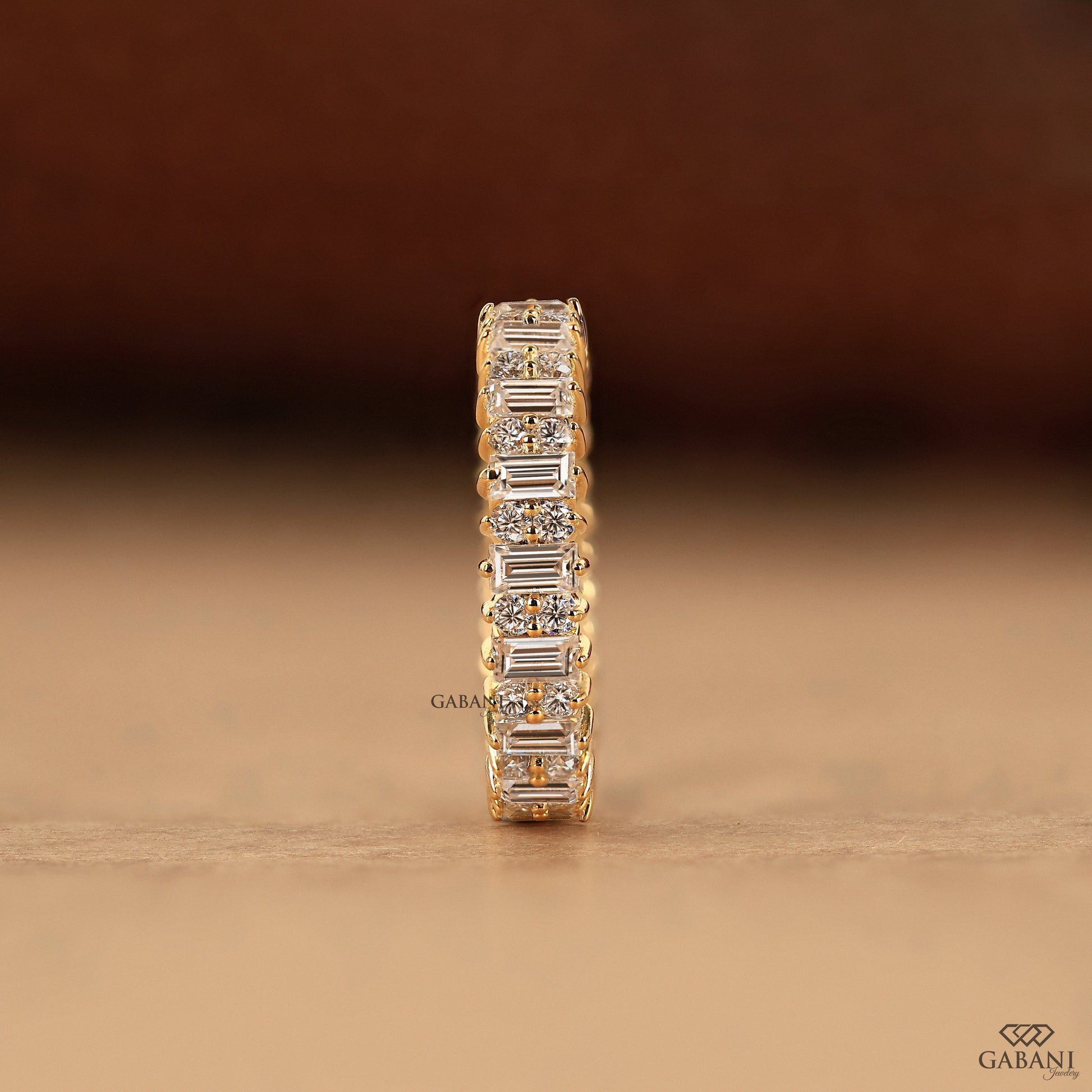 Round and baguette diamond anniversary band with wide profile
