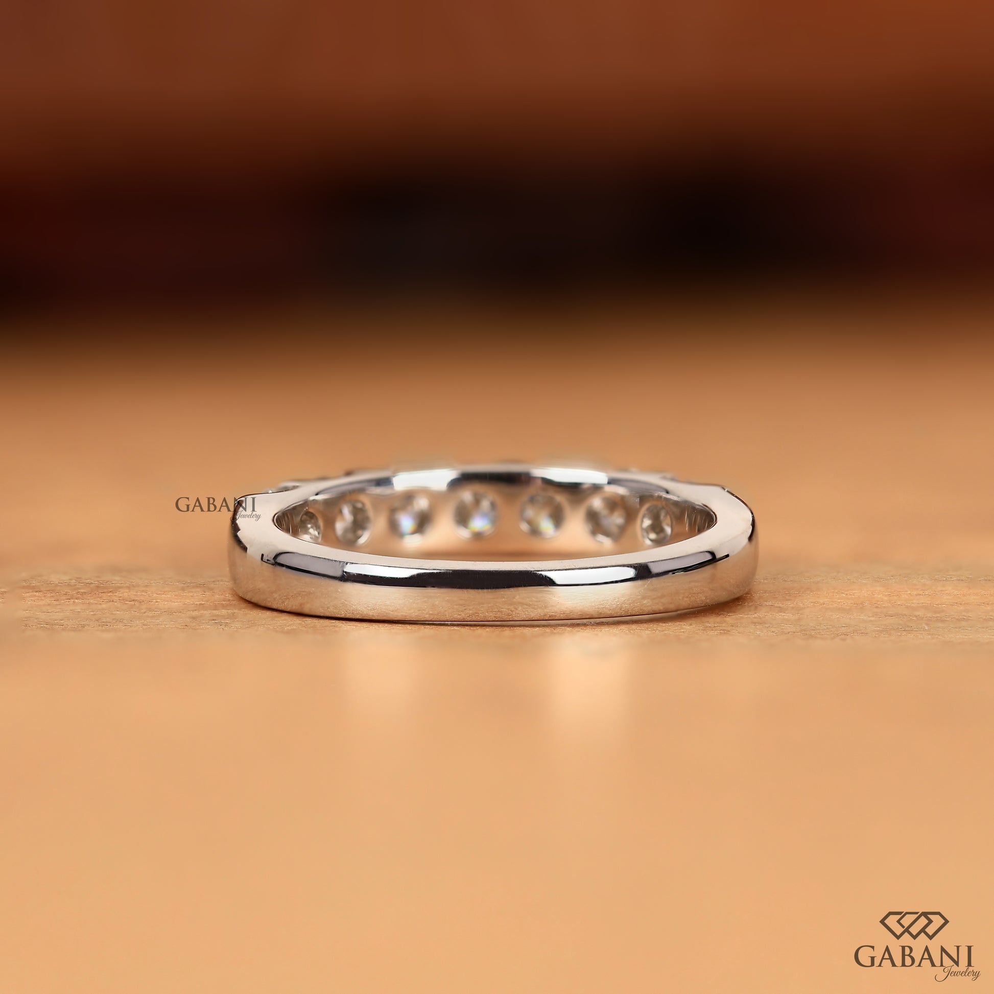 round lab grown diamond wedding band with seven stones set in French pavé white gold ring