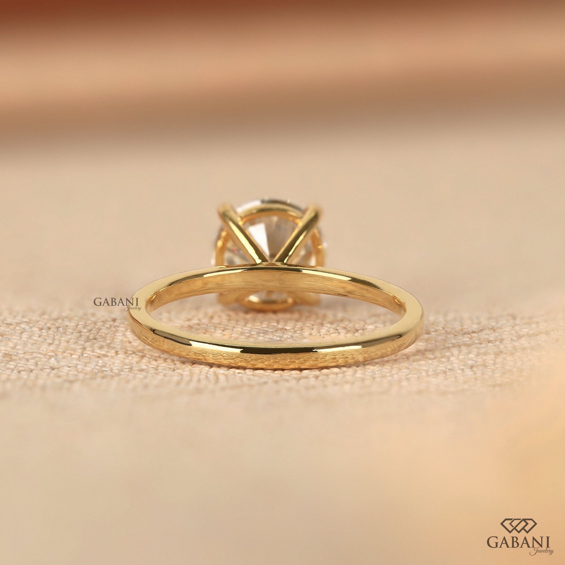 round cut lab grown diamond ring with clean prong set design in gold