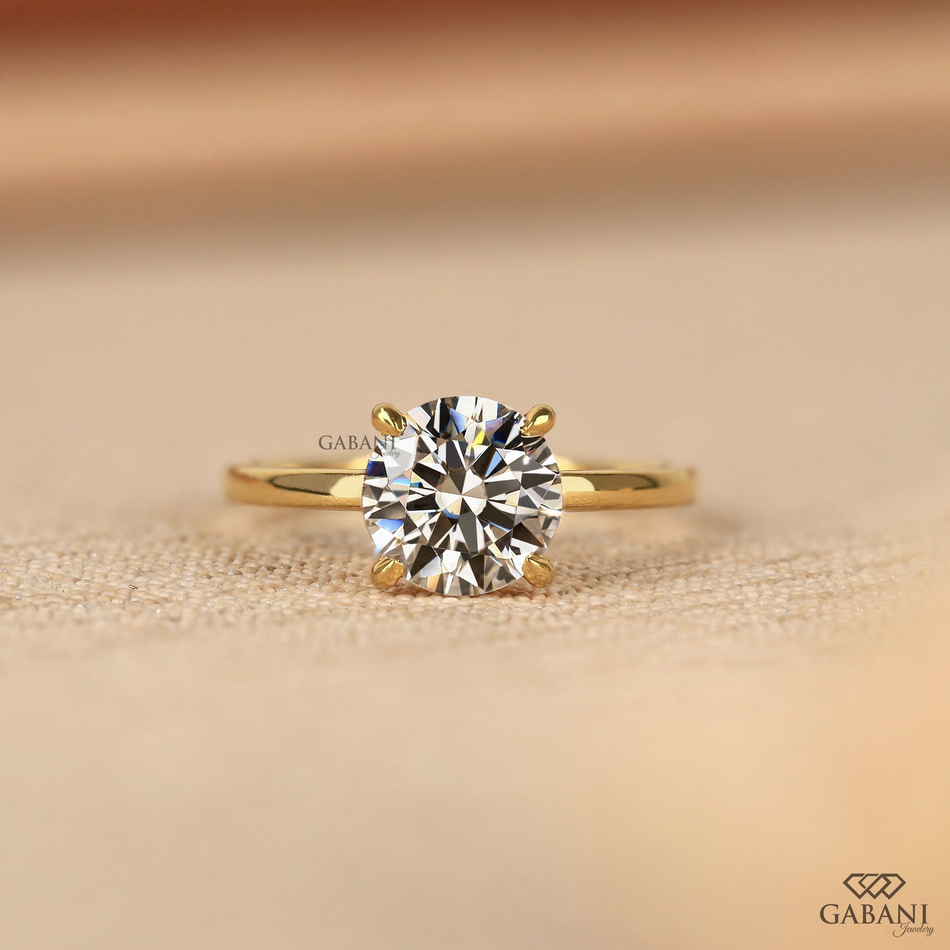 round cut lab grown diamond solitaire ring in 14k yellow gold with slim pipe shank