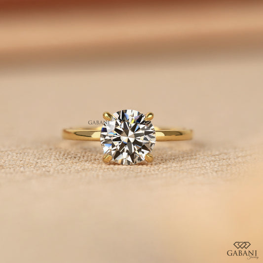 round cut lab grown diamond solitaire ring in 14k yellow gold with slim pipe shank