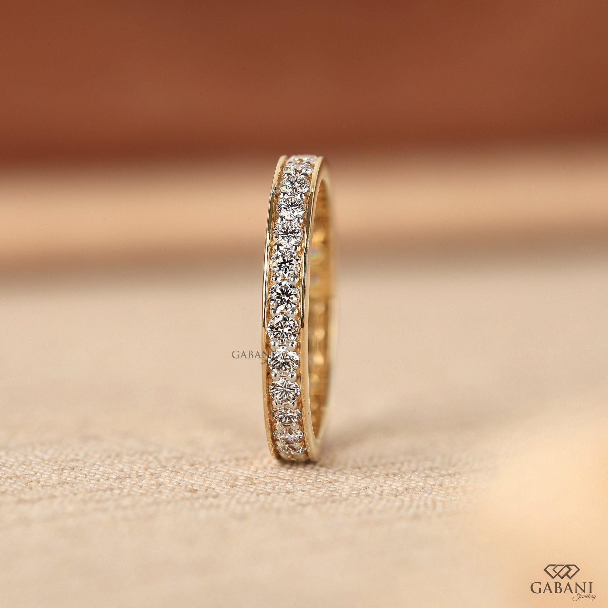 round cut lab grown diamond eternity band in solid yellow gold