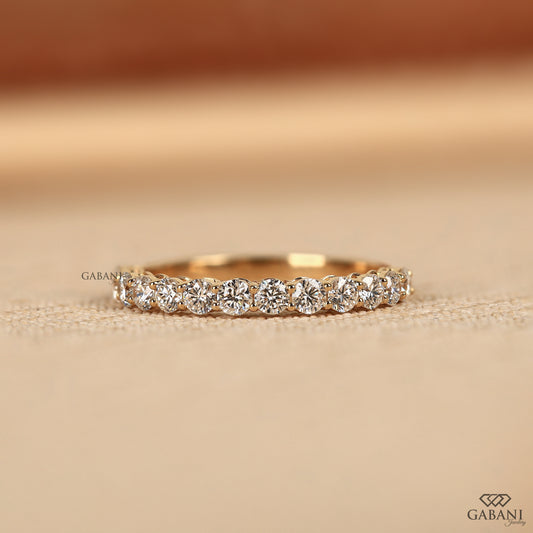 Round lab grown diamond wedding band in white gold with shared prong half eternity style