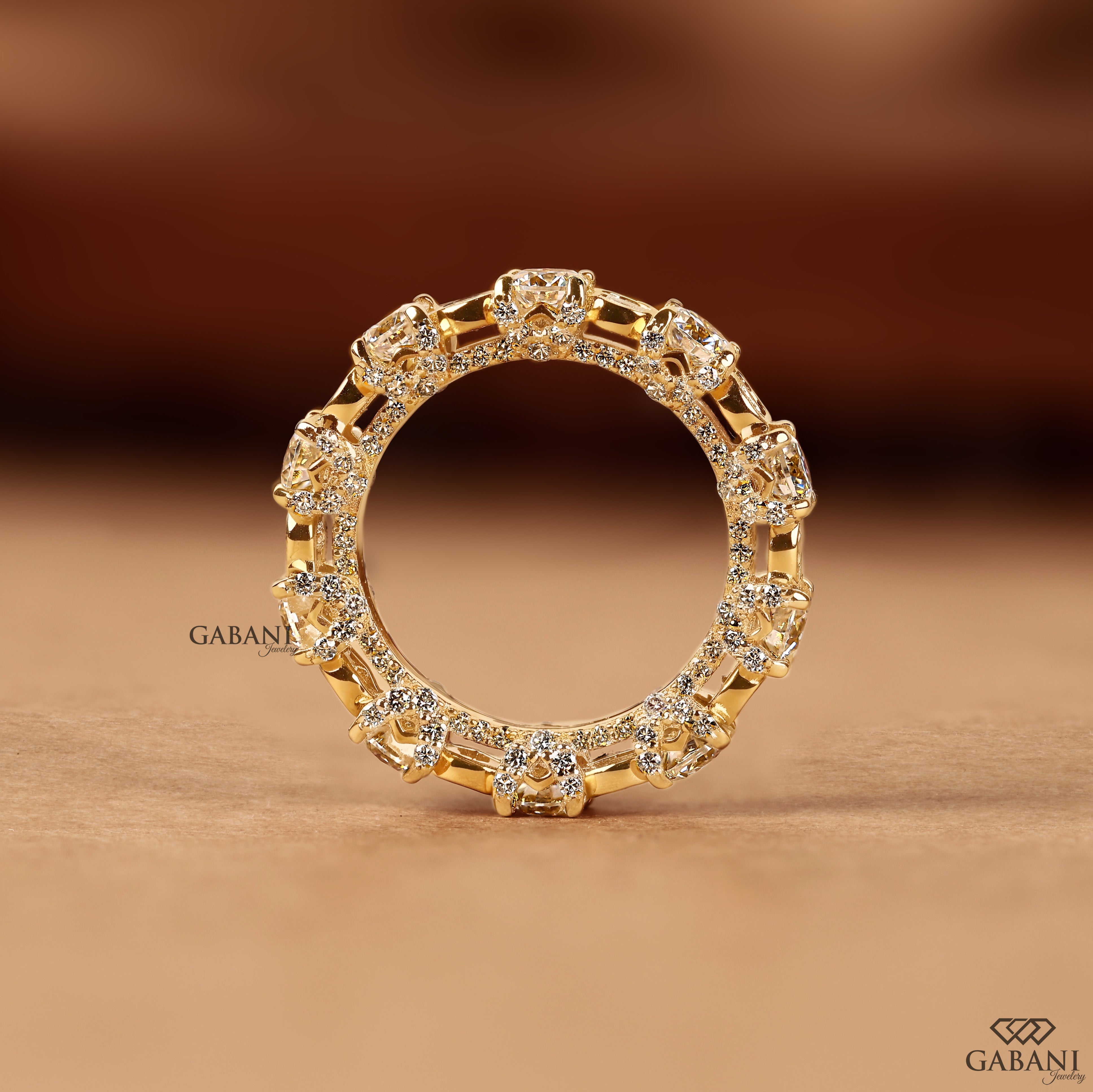 Thick diamond wedding band with alternating bezel and prong settings
