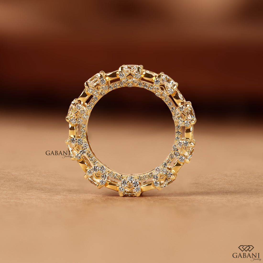 Thick diamond wedding band with alternating bezel and prong settings
