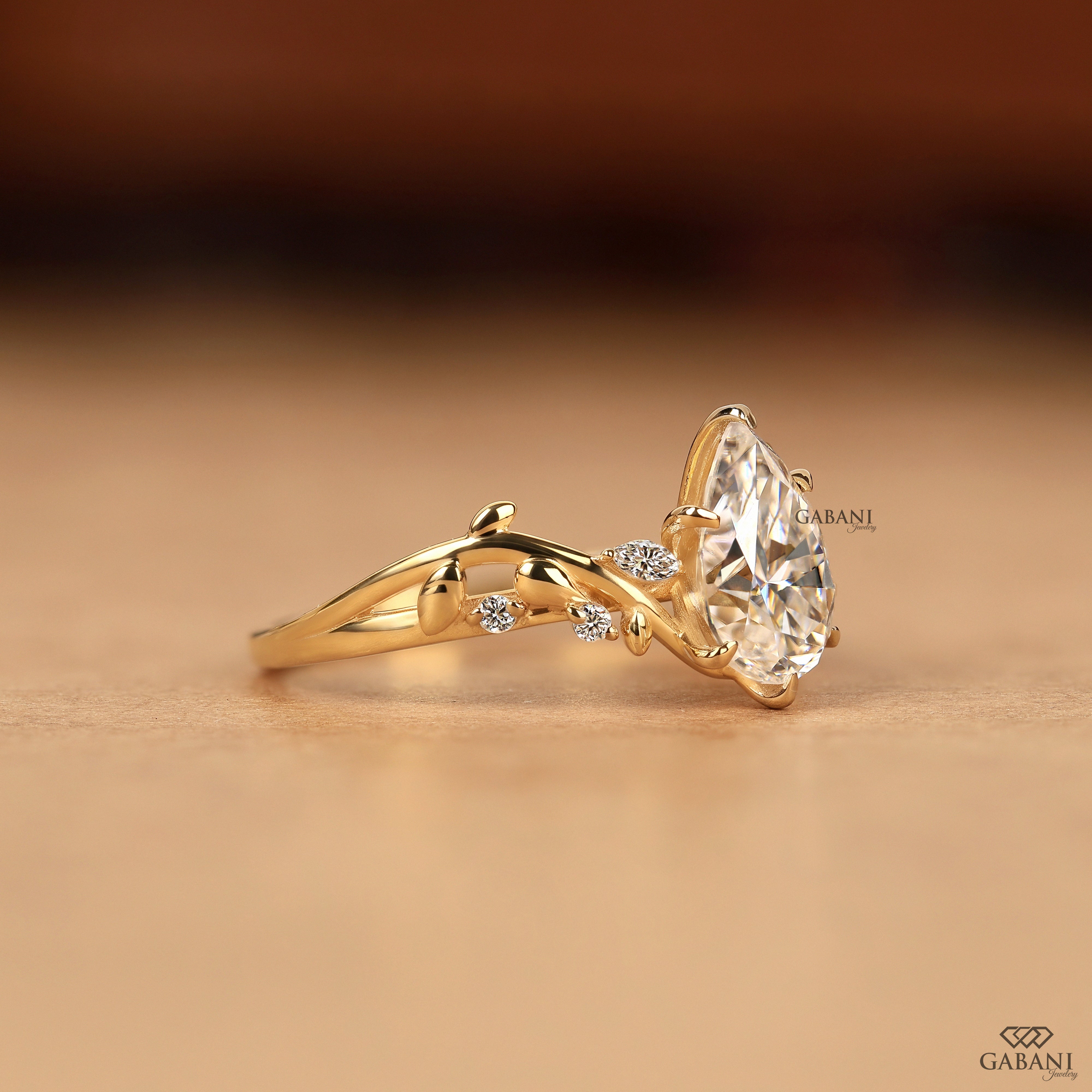 Side view of nature inspired leaf design pear cut lab grown diamond ring