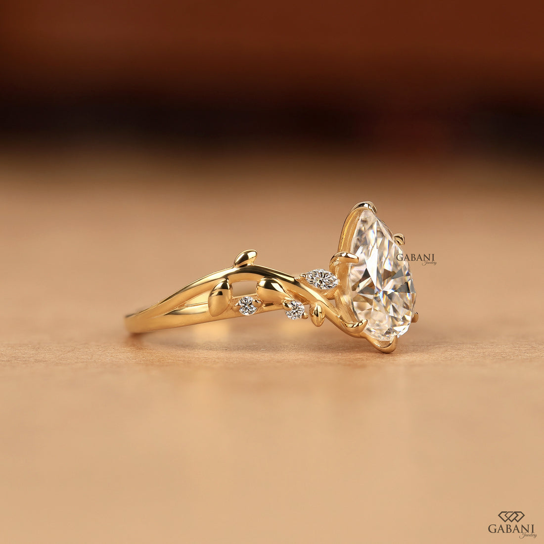 Side view of nature inspired leaf design pear cut lab grown diamond ring