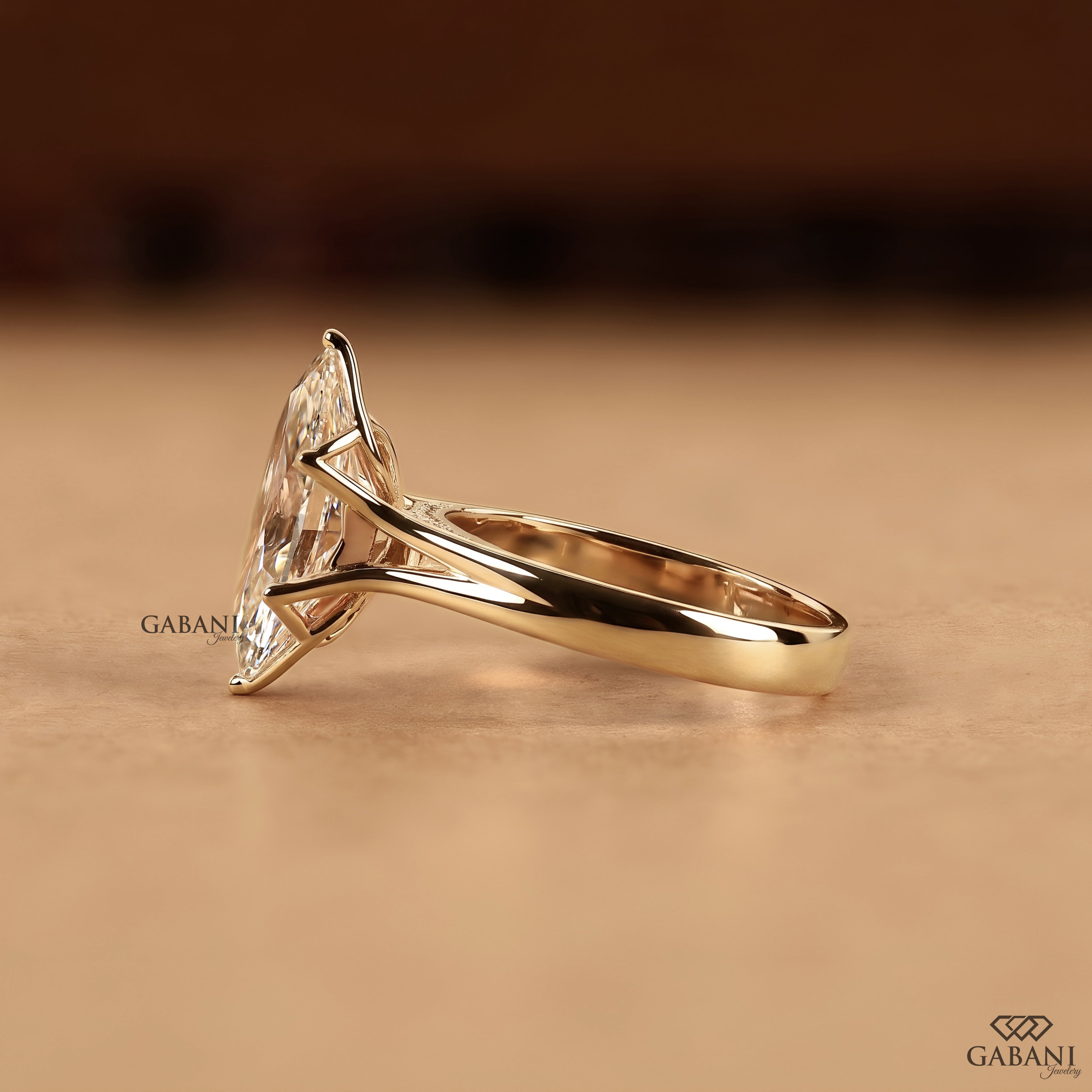Marquise cut proposal ring featuring an IGI certified lab created diamond