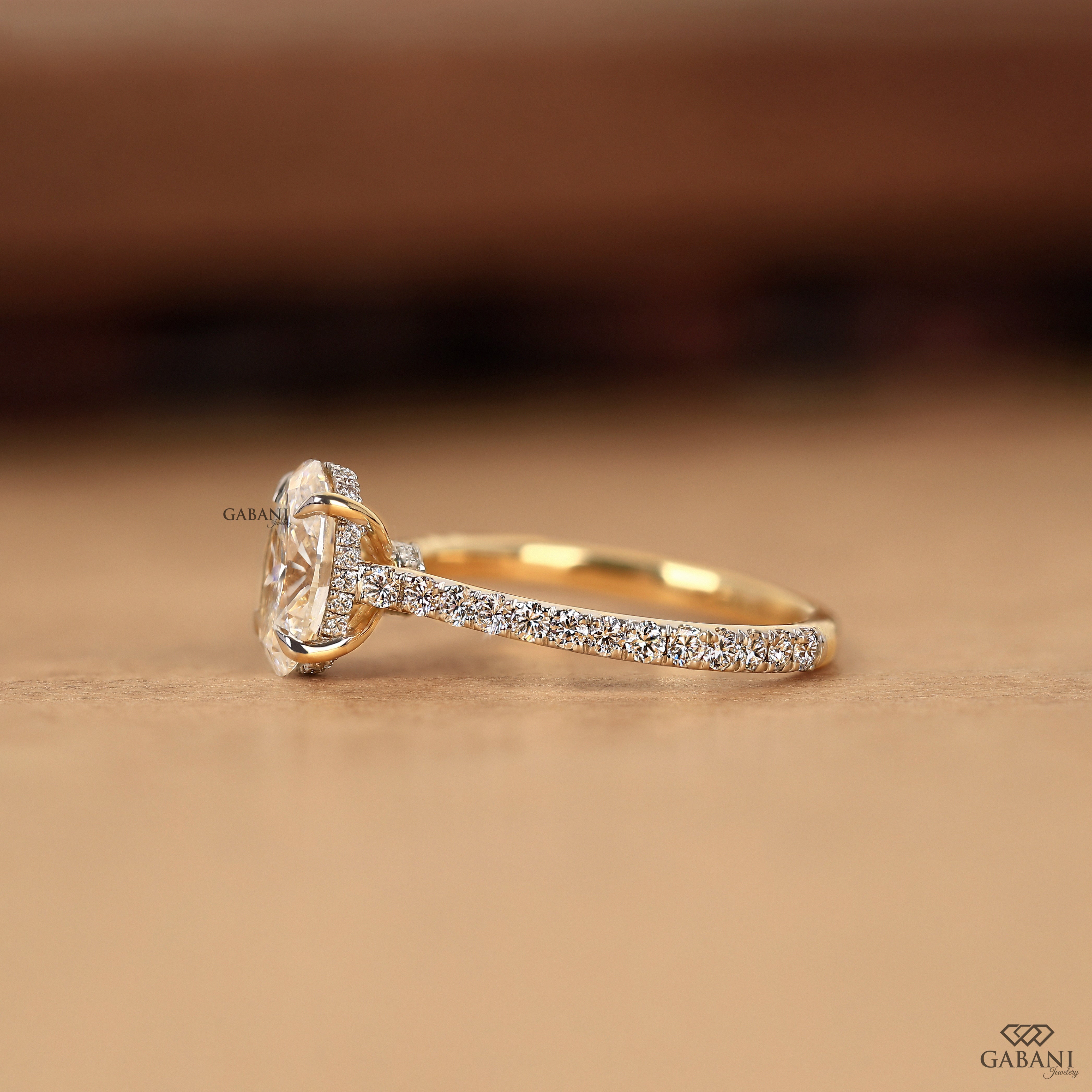 Lab grown oval diamond engagement ring with hidden halo