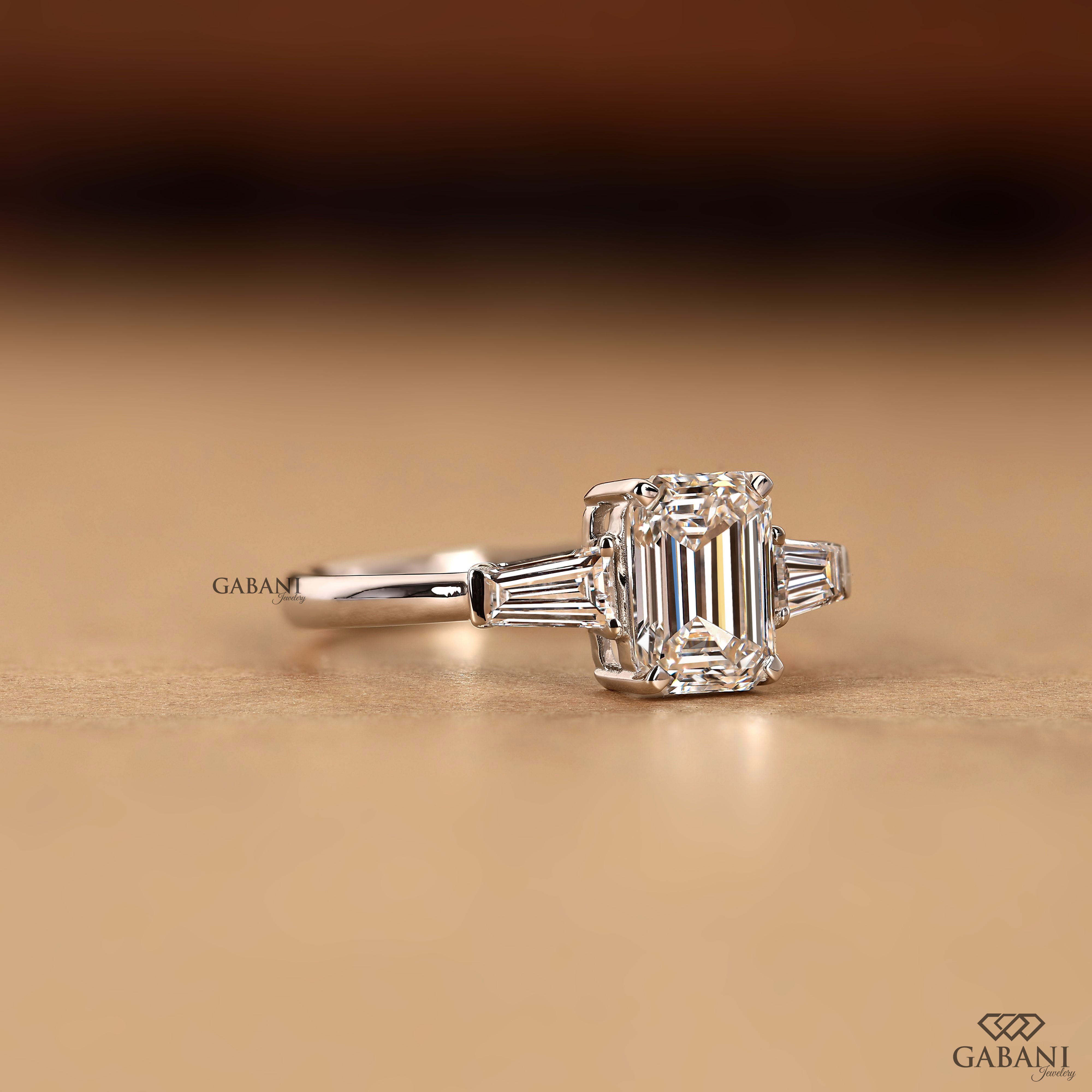 Emerald cut lab grown diamond ring with classic three stone design