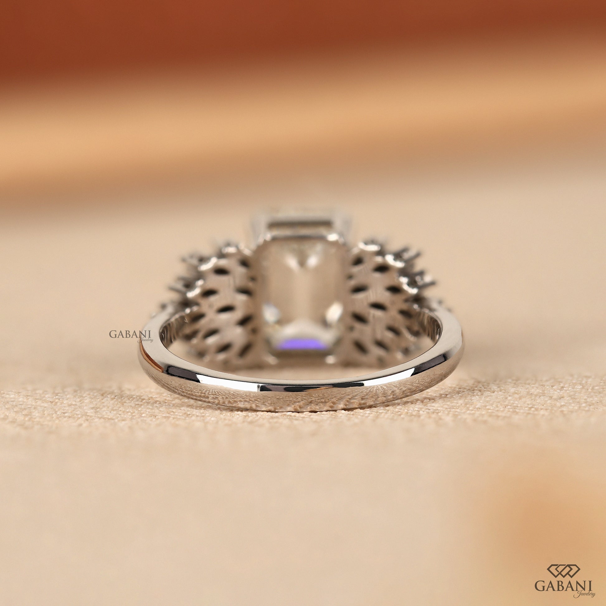 statement emerald cut lab grown diamond ring with winged marquise design