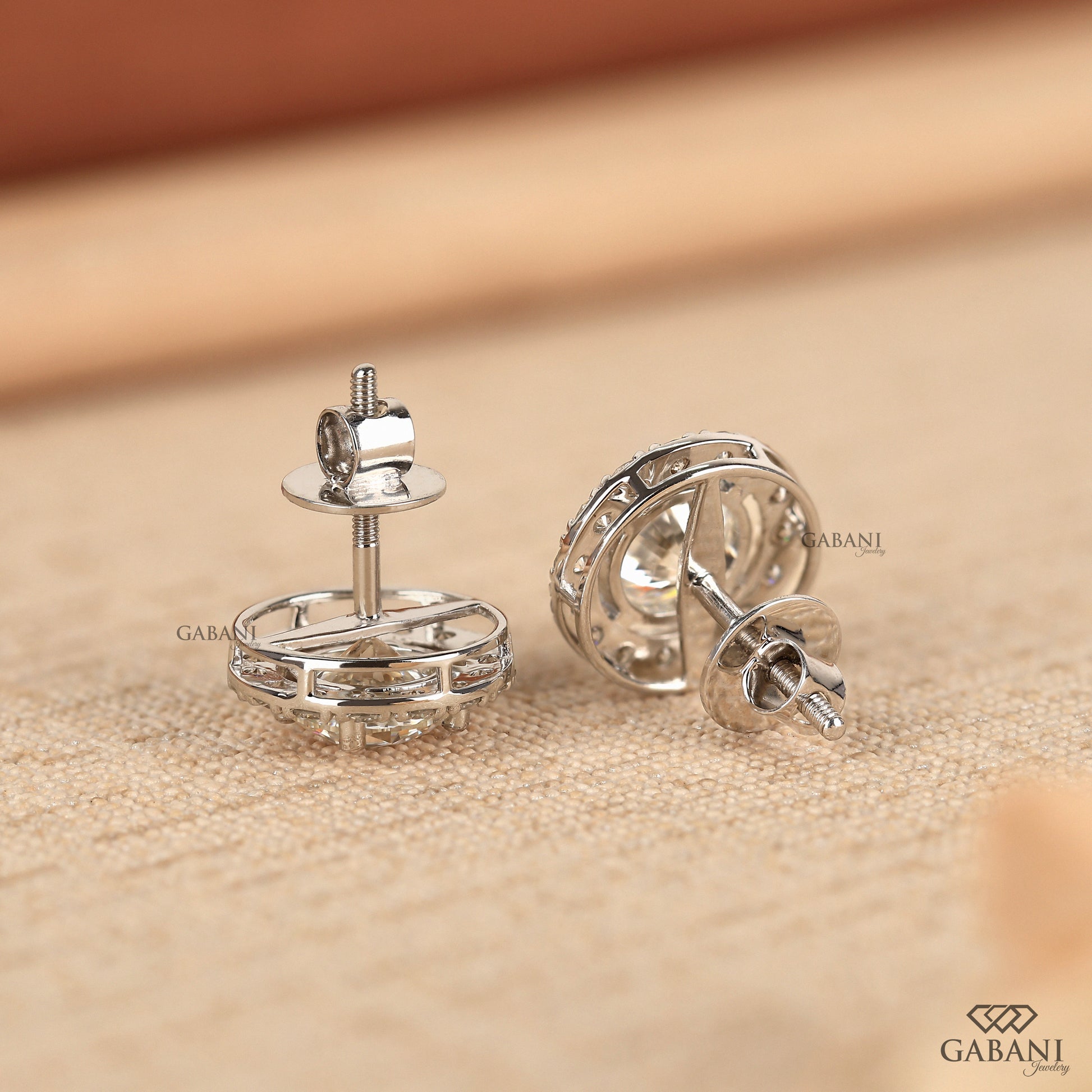 Round lab grown diamond white gold earrings with halo setting
