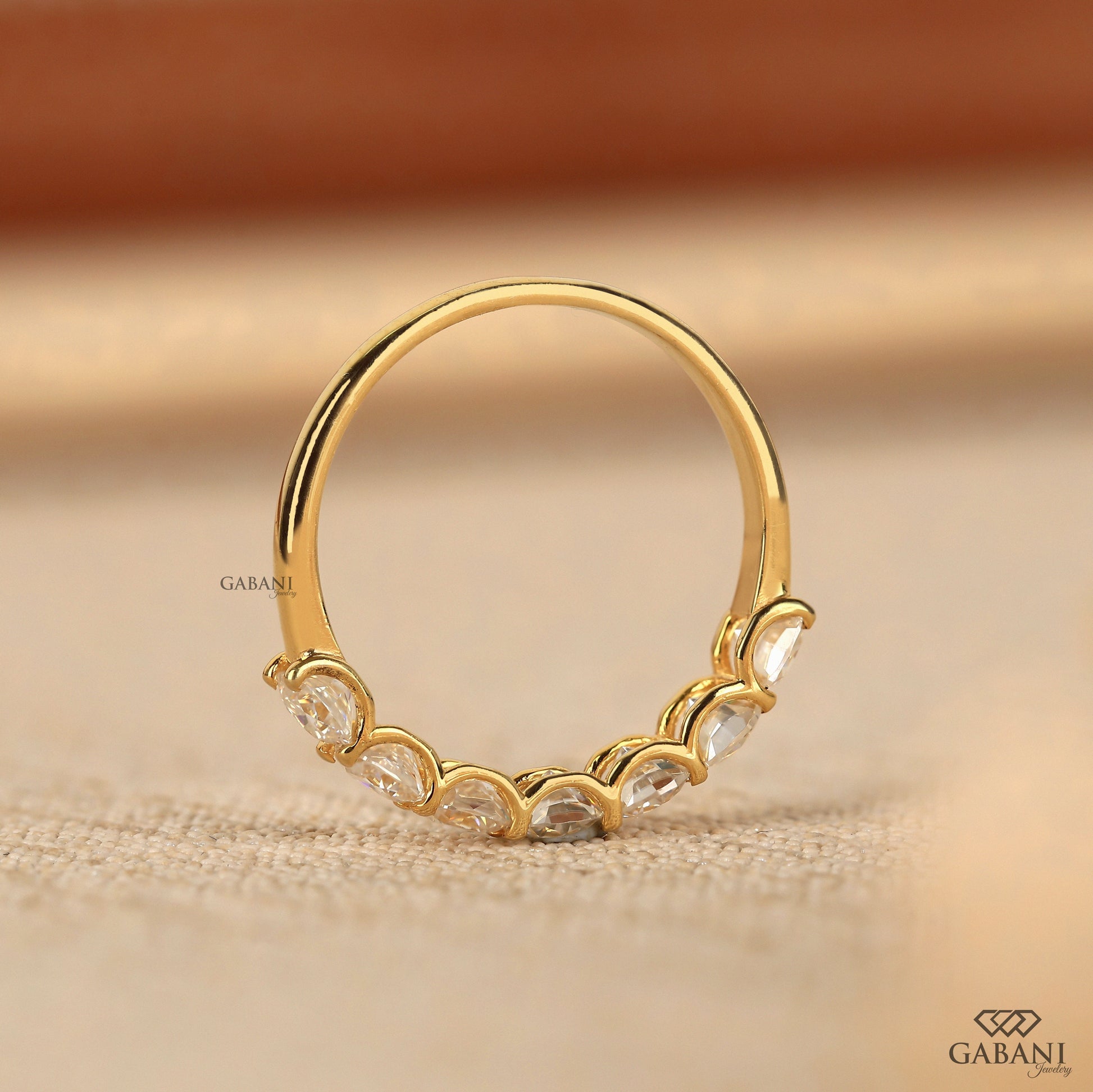 cushion cut lab created diamond half eternity band with a slim yellow gold profile
