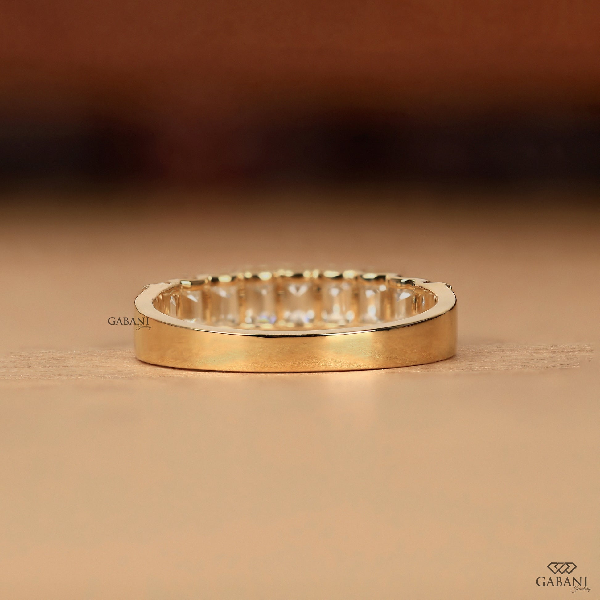 emerald diamond band in yellow gold with comfort fit interior and minimal modern style
