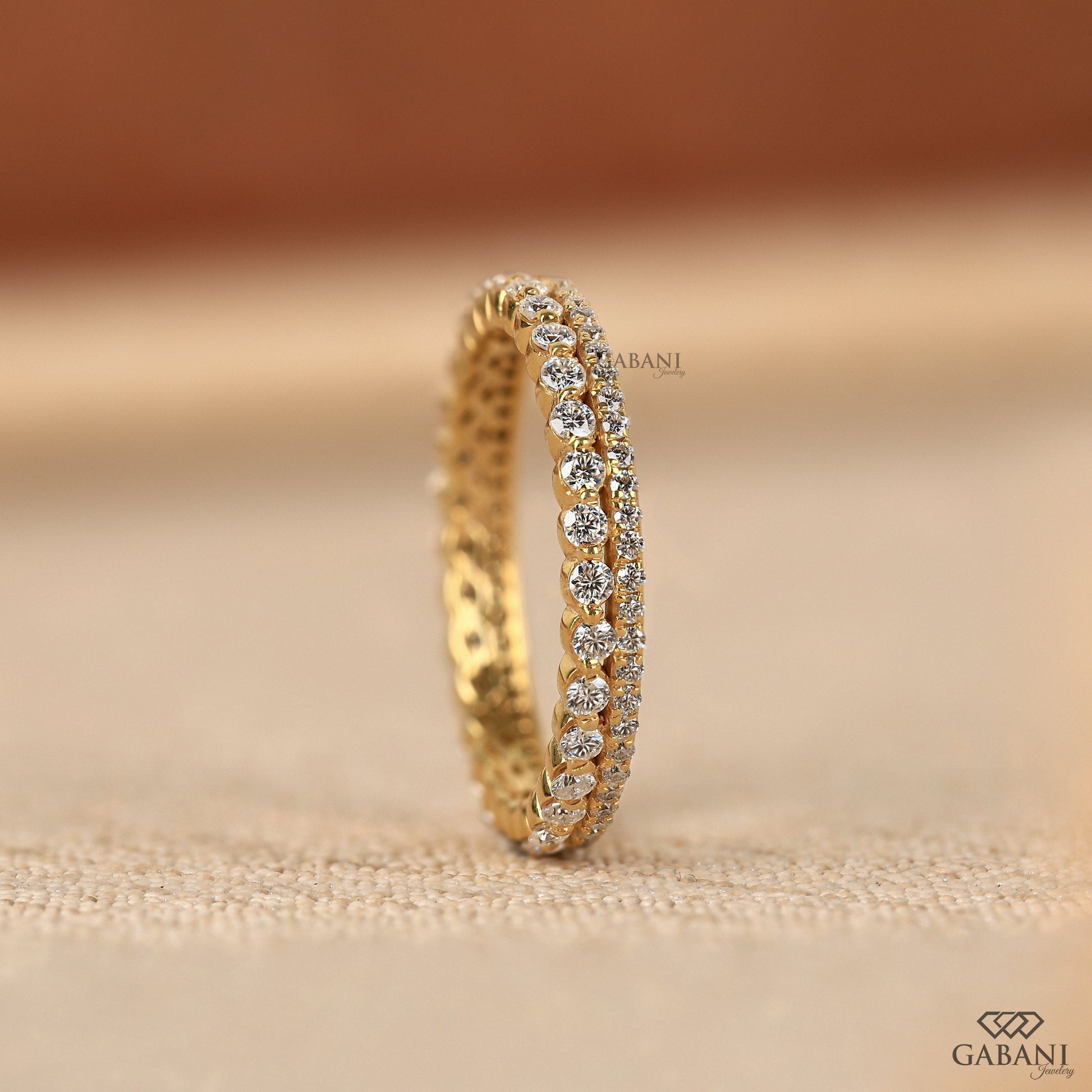 thin lab grown diamond band in yellow gold with two row pave style and modern minimal look for everyday wear