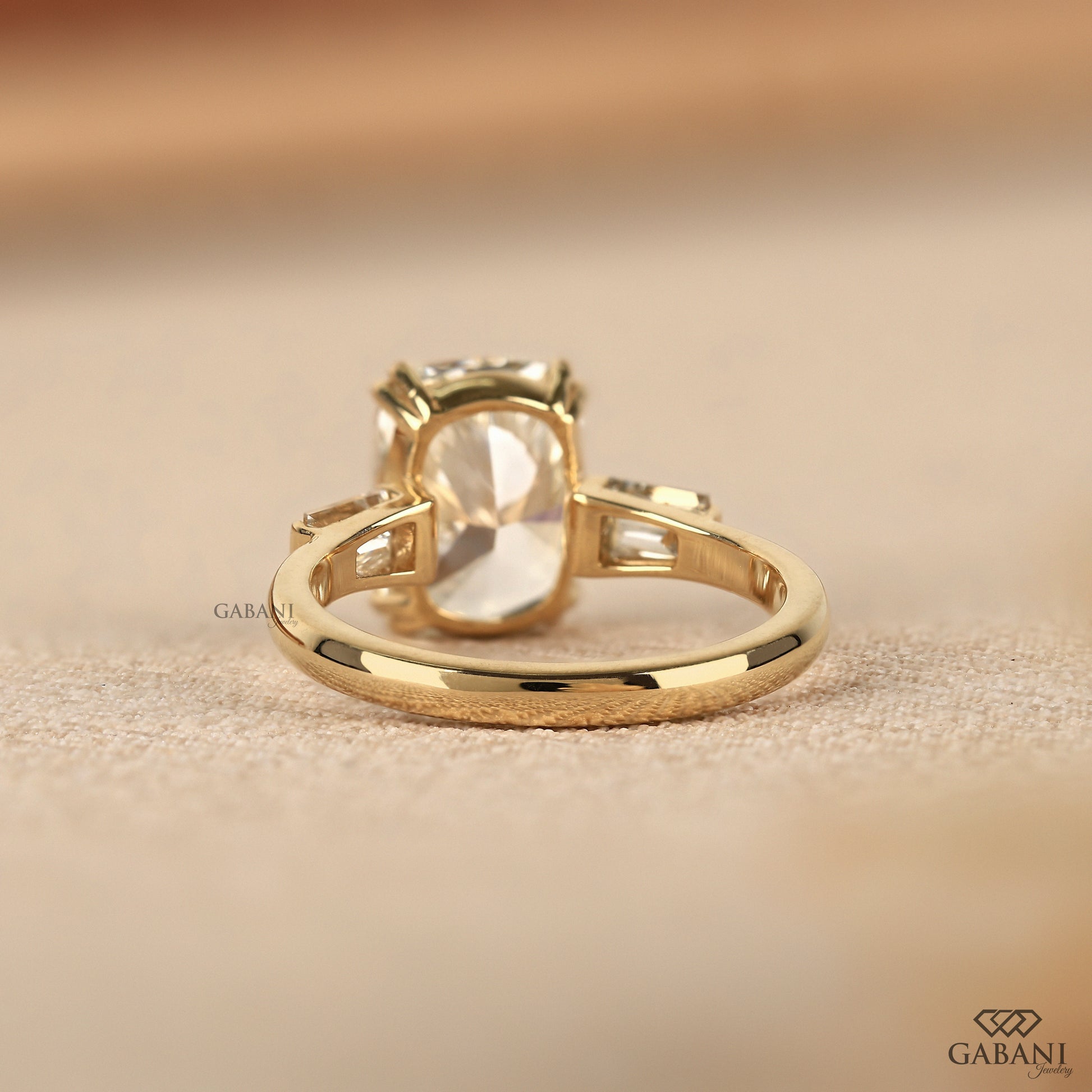 Lab created diamond engagement ring with three stone layout and moderate profile